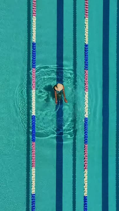 Aerial reel of a swimmer in the pool at The Cassara Carlsbad